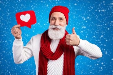 Portrait of satisfied person hold paper like card show thumb up toothy smile isolated on blue color background