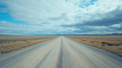 Fototapeta premium Vast Empty Road in Open Landscape with Dramatic Sky