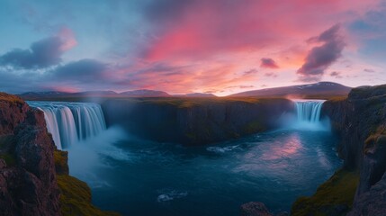 Fototapeta premium A breathtaking panorama of cascading waterfalls under a colorful sunset.