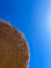 Straw umbrella on beach with blue sky 
