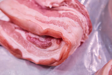 Sliced Pork Belly Neatly Stacked in a Tray