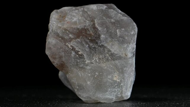 Fluorite (fluorspar) sample rotating slowly against a black background [