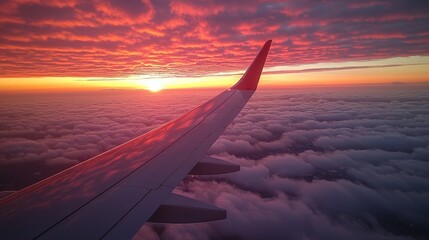 Airplane wing soaring above pink clouds at sunset with a vibrant sky and dramatic light Generative AI