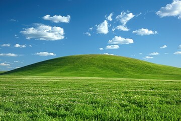 Fototapeta premium Rolling Green Hills Under a Blue Sky with White Clouds