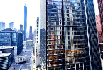 Downtown Manhattan A towering skyscraper complex with sleek glas