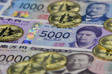 Japanese Yen New Note and a coin symbolizing Bitcoin