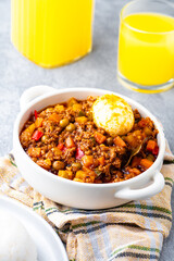 Filipino-style Picadillo with ground meat, potatoes, carrots, green peas, bell peppers and boiled egg on the side.