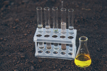 Soil analysis in a test tube. Selective focus.