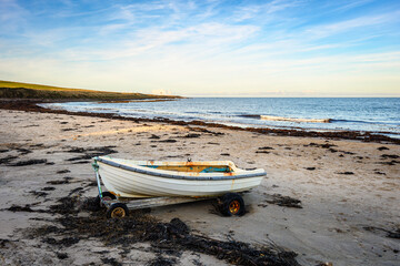 Old Rowing Boat on Low Newton Beach, also known as Low Newton-by-the-sea it is a small fishing...