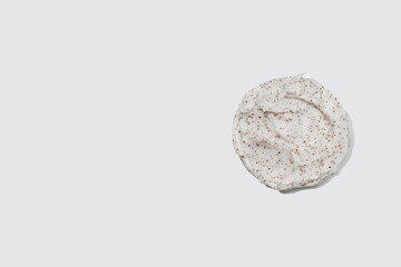 Smears of body scrub on white background. Fruit and berry body scrub texture of the swatch. Cosmetic smear