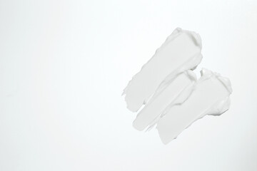 Beauty skincare cream texture swipe swatch. White beauty cream smear smudge isolated on white background