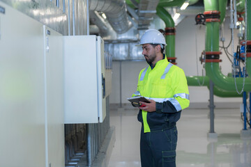 Engineer work in Industrial  chiller  HVAC heating ventilation air conditioning system and pipping...