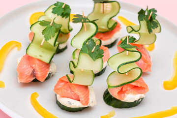 Canapes without Bread with Fresh Salmon, Cucumber and Cream Cheese on White Plate. Easy Breakfast....