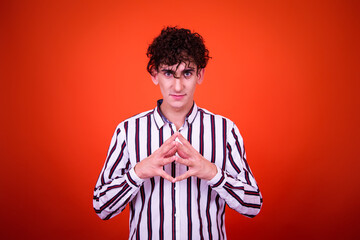 Funny young man posing in studio.