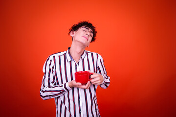 Funny young man posing in studio.