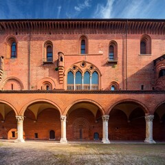 Fototapeta premium detail of a medieval red-brick palace, AI generated