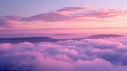 Majestic pink and purple clouds at sunset over rolling hills and forest