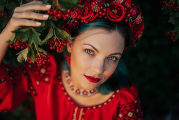 Charming Ukrainian Woman In Traditional Outfit, Wreath. Red viburnum tree.