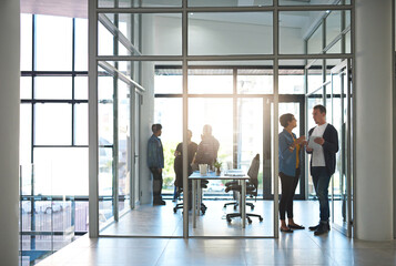 Business people, tablet and meeting in office for collaboration, feedback and communication with...