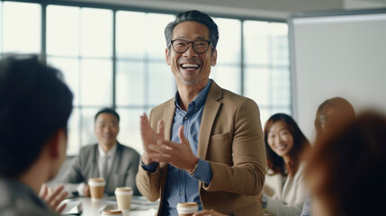 Smiling man leading a business meeting in a modern office setting...