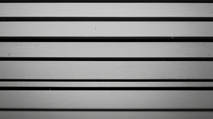 Uniform parallel lines with consistent spacing, creating a rhythmic pattern, evoking a sense of order and simplicity in design.