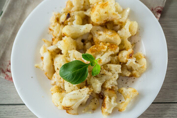 Diet boiled cauliflower fried in oil with spices