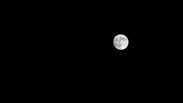 Full moon  supermoon moves through the night sky