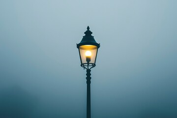 A Single Street Light Illuminating a Foggy Sky