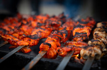 Vendor selling chicken tikka at a market