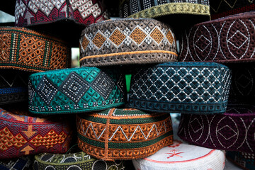 Hats displayed for sell, at a market ahead of Eid Ul-Fitr 