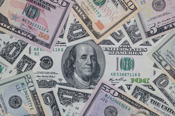different US dollar banknotes background