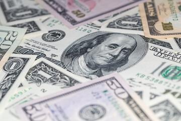 different US dollar banknotes background