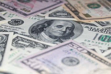 different US dollar banknotes background