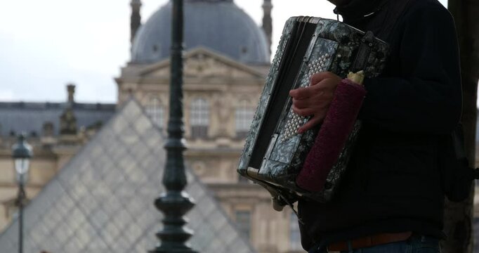 Accordion player near the Louvre Museum in Paris, France