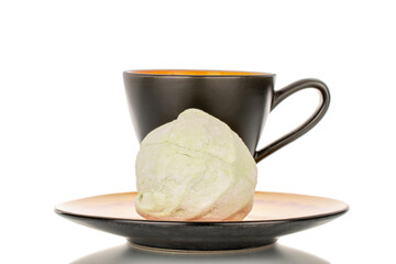 Sweet delicious pear marshmallow on ceramic saucer with cup, macro isolated on white background.