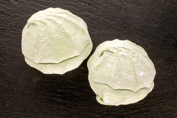 Sweet delicious pear marshmallow  on slate stone, macro, top view.