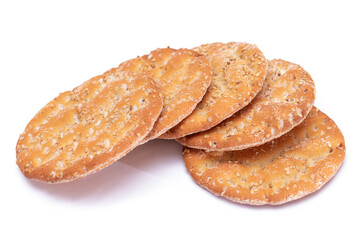 A Heap of Round Salt Crackers with Sesame Isolated on White Background. Dry Snacks - Isolation