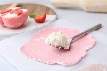 Dough for tasty homemade mochi and cream on table, closeup