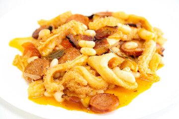 Beef tripe (bucho), beef stomach, tripe on a white plate. Dobradinha