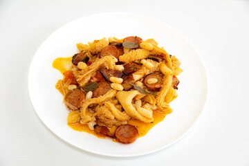 Beef tripe (bucho), beef stomach, tripe on a white plate. Dobradinha