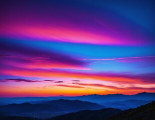 Fototapeta premium Sunset over mountains with vibrant pink and purple skies