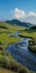 A river runs through a lush green valley with mountains in the background. The scene is serene and peaceful, with the water flowing gently and the grassy hills providing a beautiful backdrop