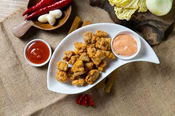 Indonesian snack appetizer deep fried tempe chicken calamari golden brown