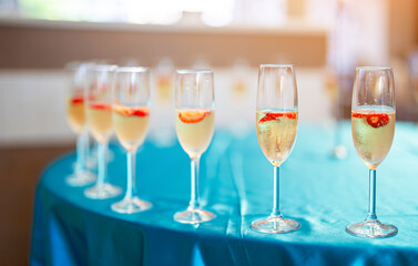 Glasses of chilled champagne at the entrance to the event.