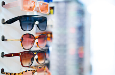 Large selection of multicolored sunglasses.