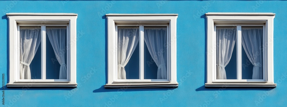Poster flowing curtains in a row of identical open windows create a serene and inviting atmosphere in a cha