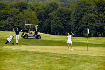 Experience the Joy of Spending a Day on the Beautiful Golf Course Golfers in Action