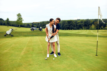 Obraz premium Enjoy a Romantic Golfing Experience Together on a Bright and Sunny Day in Nature