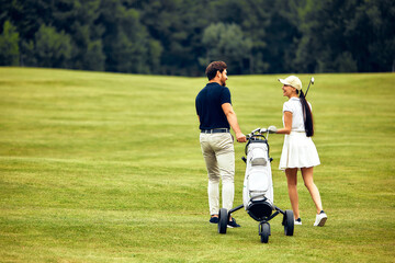 A Loving Couple Enjoys a Joyful Day Together at the Golf Course, Making Memories