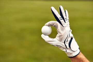 A Golf Enthusiast Proudly Holding a Golf Ball with a Perfect Grip Technique in Hand
